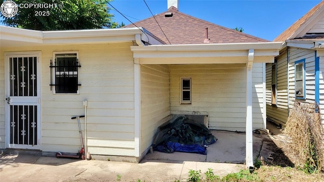 1318 Spruce St, Pueblo, CO 81004 - view of side of home with a shingled roof
