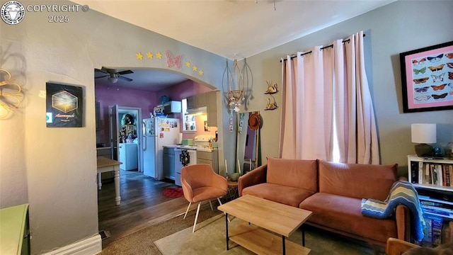 1318 Spruce St, Pueblo, CO 81004 - living room with arched walkways, a ceiling fan, and wood finished floors