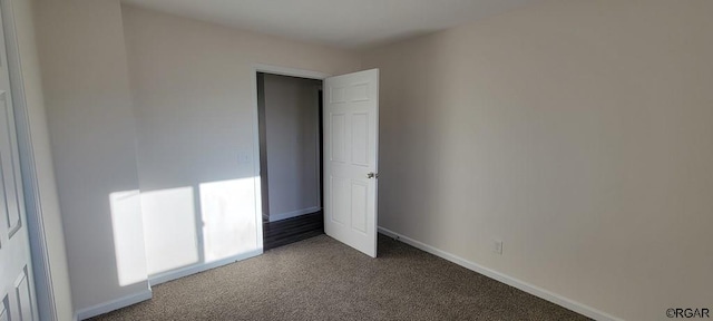 unfurnished bedroom with carpet floors