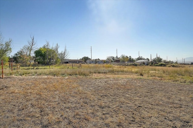 view of yard with a rural view