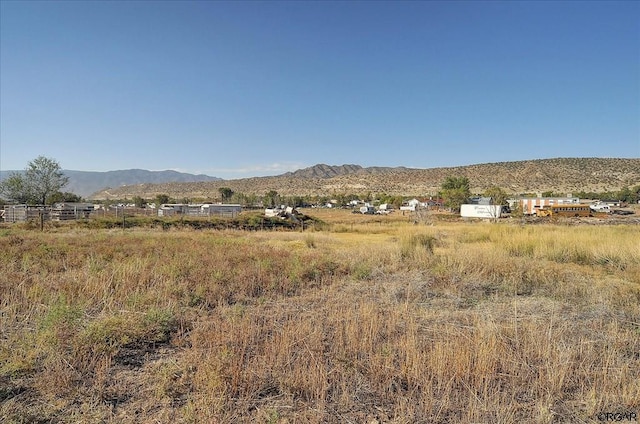 view of mountain feature with a rural view