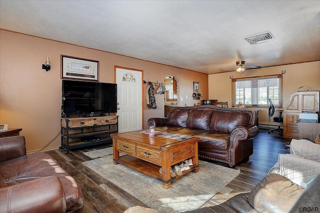 living room with dark hardwood / wood-style flooring