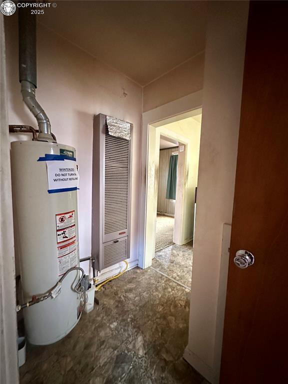 hall featuring gas water heater