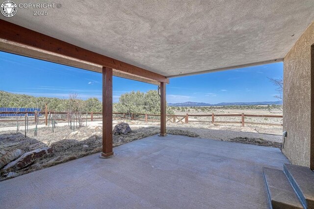 750 Roundup Rd, Westcliffe, CO 81252 - view of patio / terrace featuring a mountain view and a fenced backyard