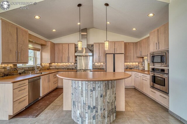 750 Roundup Rd, Westcliffe, CO 81252 - kitchen with wall chimney exhaust hood, a sink, appliances with stainless steel finishes, vaulted ceiling, and a kitchen island