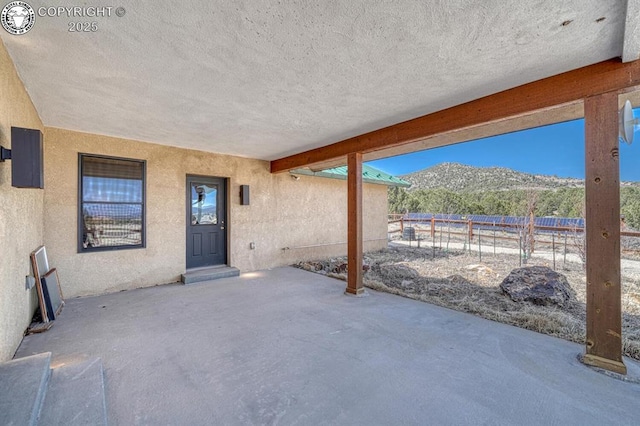 750 Roundup Rd, Westcliffe, CO 81252 - view of patio / terrace with a mountain view and fence