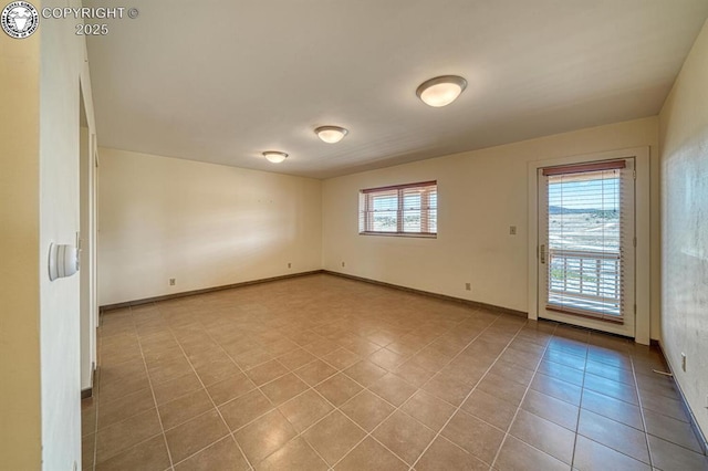 750 Roundup Rd, Westcliffe, CO 81252 - empty room with tile patterned floors and baseboards