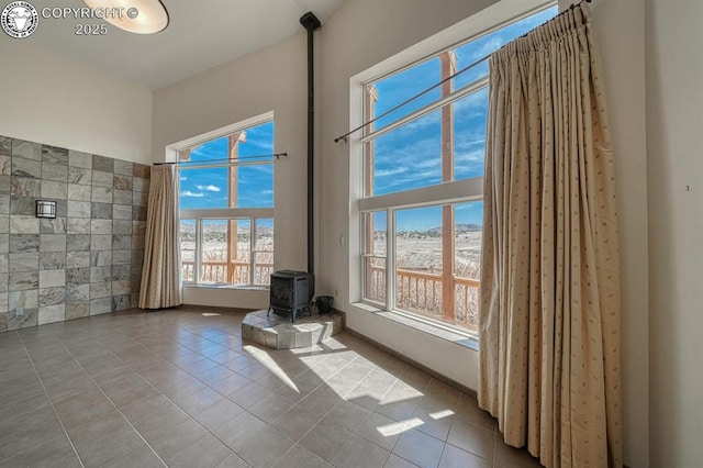 750 Roundup Rd, Westcliffe, CO 81252 - interior space featuring tile patterned floors and a wood stove