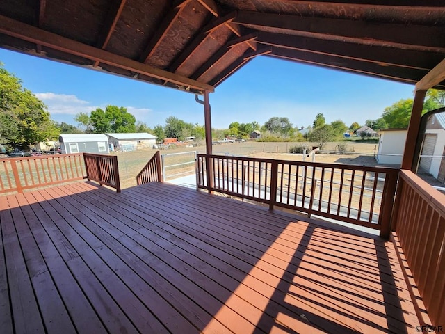 wooden deck with a lawn