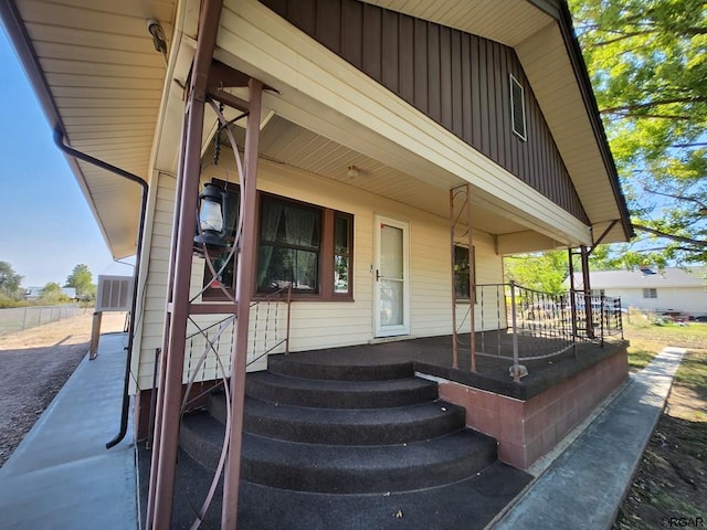 entrance to property featuring covered porch