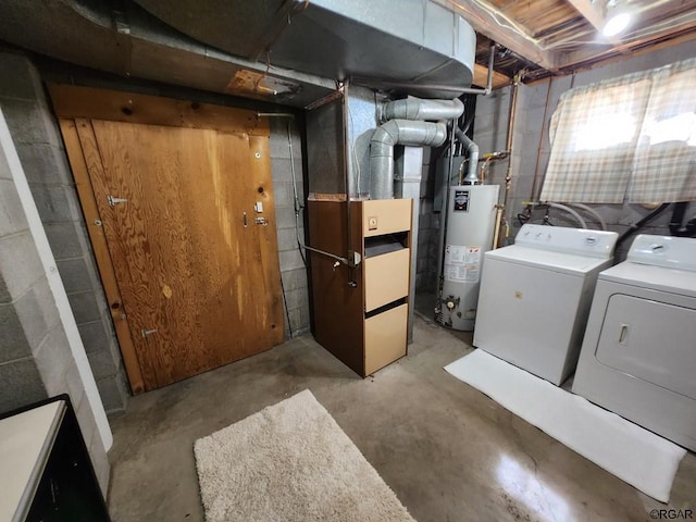 basement featuring gas water heater, heating unit, and washing machine and clothes dryer