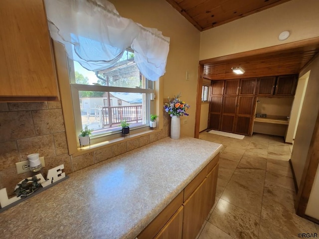 interior space with decorative backsplash and wooden ceiling