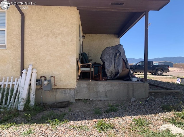 206 Arrowhead Dr, Florence, CO 81226 - view of home's exterior with stucco siding and a mountain view