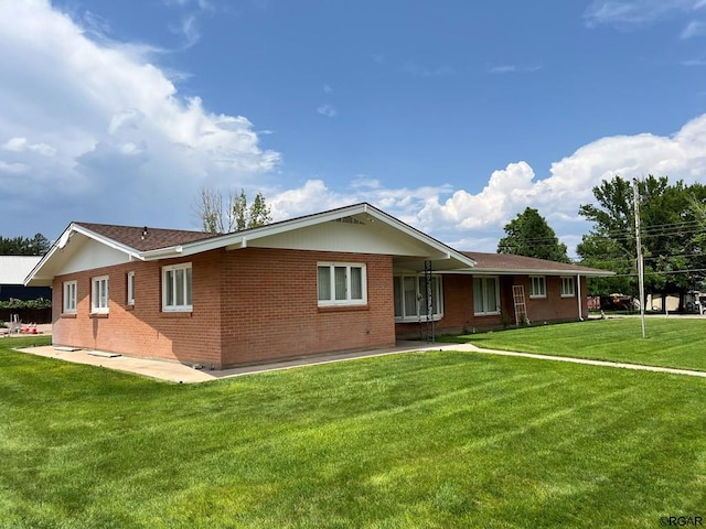 exterior space featuring a front lawn