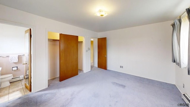 unfurnished bedroom with a baseboard radiator, light carpet, and a closet