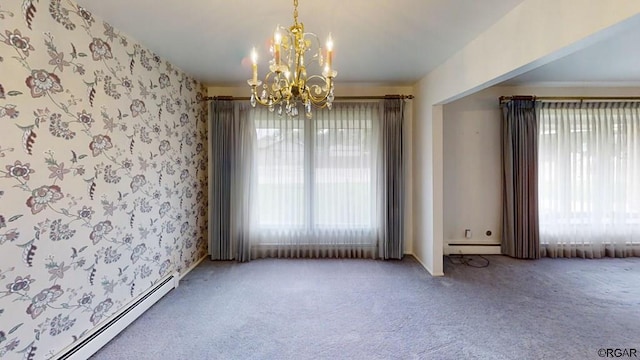 empty room with baseboard heating, carpet floors, and a notable chandelier