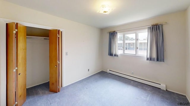 unfurnished bedroom with a baseboard radiator, a closet, and dark colored carpet