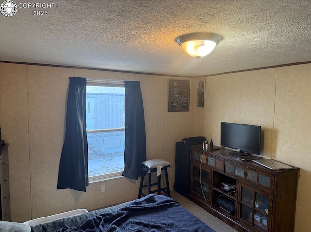 carpeted bedroom featuring a textured ceiling