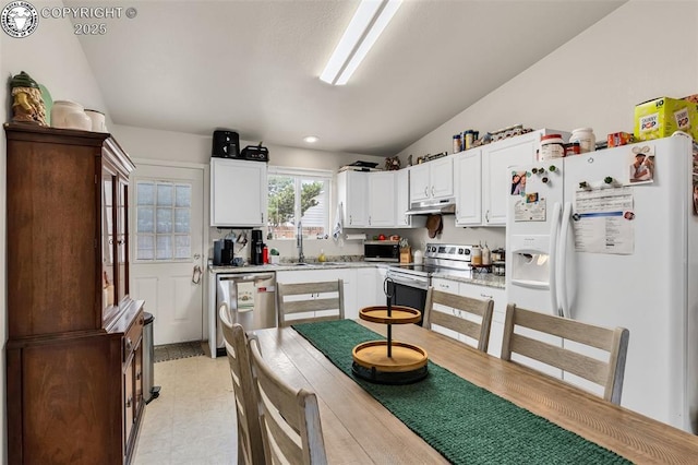 92 Georgia Ln Unit A & B, Canon City, CO 81212 - kitchen featuring stainless steel appliances, under cabinet range hood, vaulted ceiling, light countertops, and white cabinetry