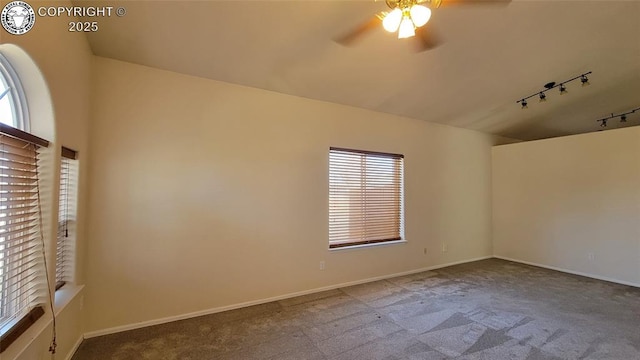 1002 Cedarcrest Dr, Pueblo, CO 81005 - carpeted empty room featuring rail lighting, a ceiling fan, and healthy amount of natural light