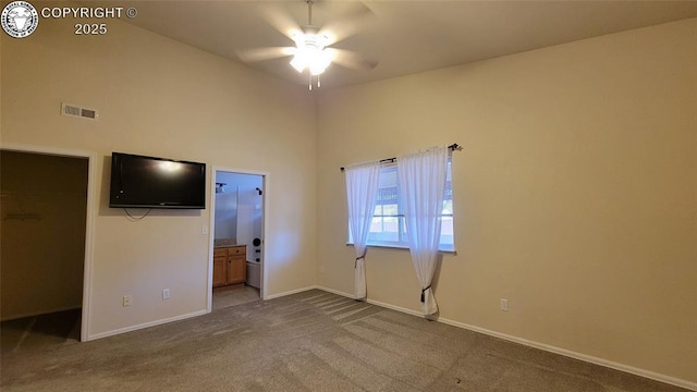 1002 Cedarcrest Dr, Pueblo, CO 81005 - unfurnished bedroom with carpet flooring, a spacious closet, a towering ceiling, and ensuite bath