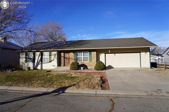 ranch-style house featuring a garage