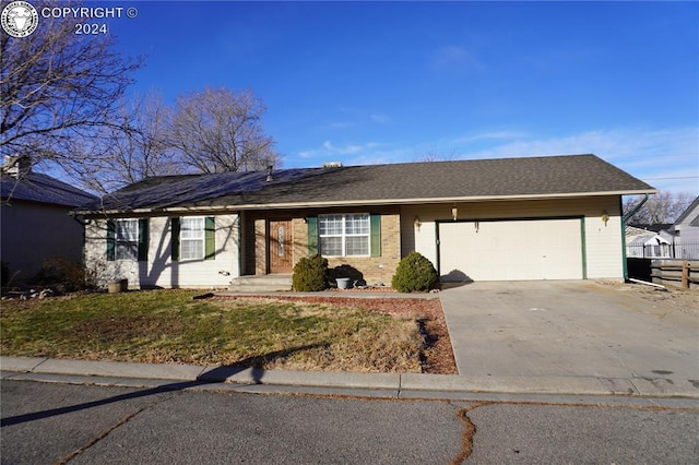 single story home featuring a garage