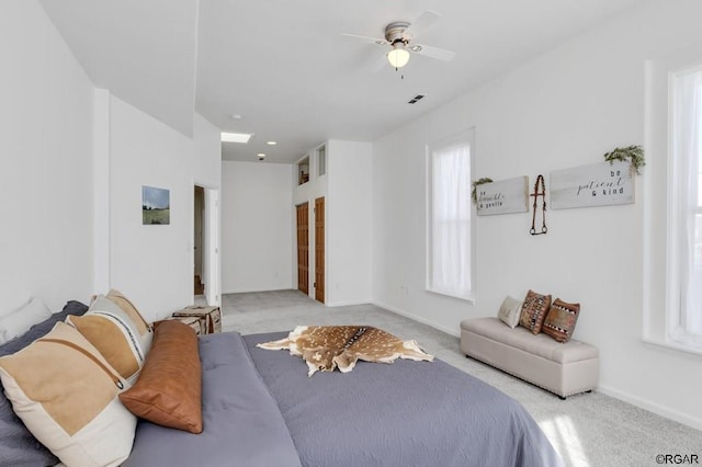 bedroom with light colored carpet and ceiling fan