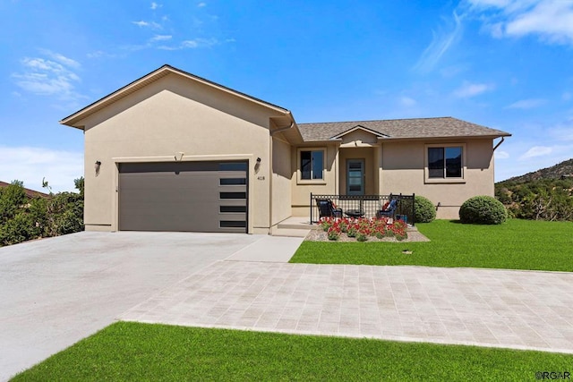 view of front facade with a garage and a front yard