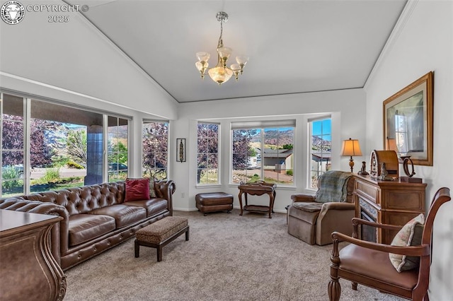 living area featuring baseboards, lofted ceiling, carpet, and a chandelier