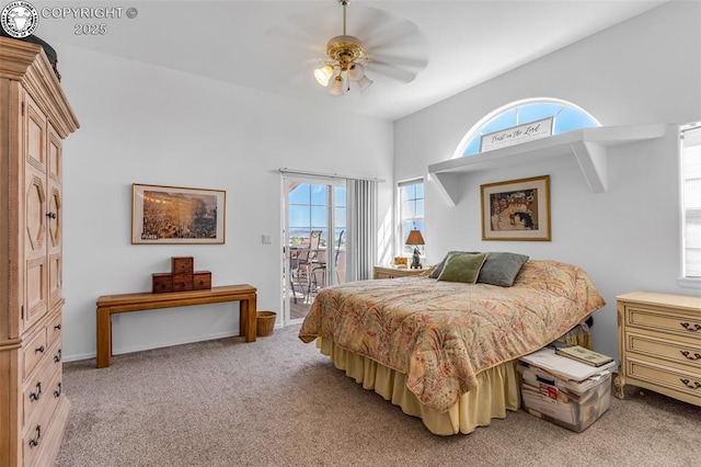 bedroom with ceiling fan, light colored carpet, and access to exterior