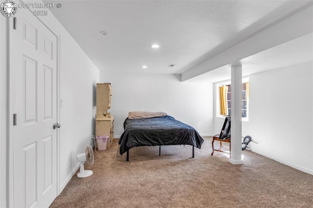 carpeted bedroom featuring recessed lighting and baseboards