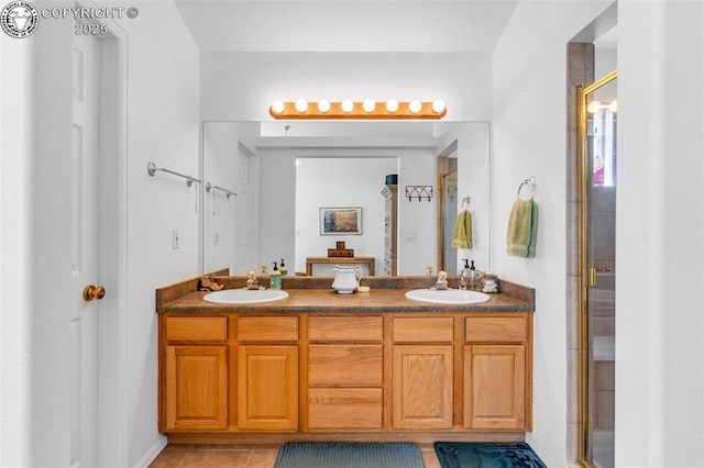 full bath with a sink, double vanity, and a shower stall