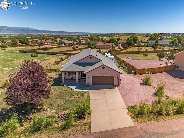 birds eye view of property featuring a mountain view