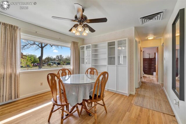 1815 N 10th St, Canon City, CO 81212 - dining area with light wood-style flooring, baseboards, a ceiling fan, and visible vents