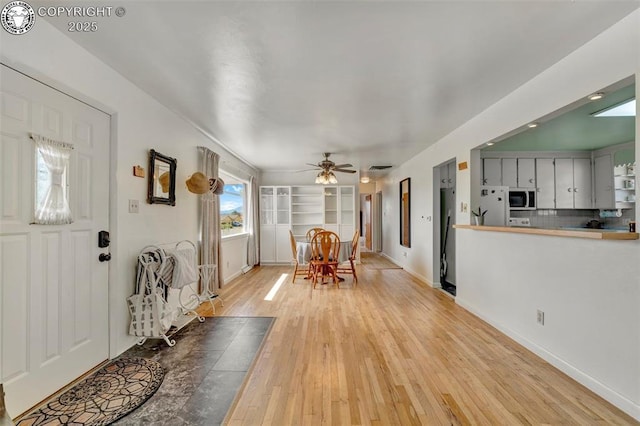 1815 N 10th St, Canon City, CO 81212 - entrance foyer featuring light wood-type flooring, baseboards, and a ceiling fan
