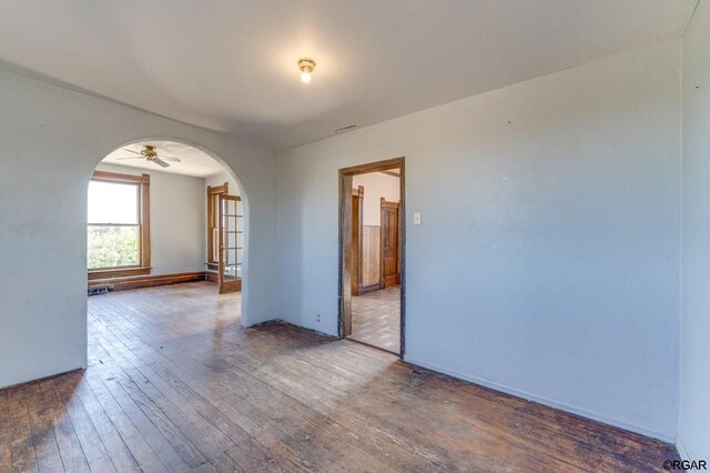 unfurnished room featuring wood-type flooring