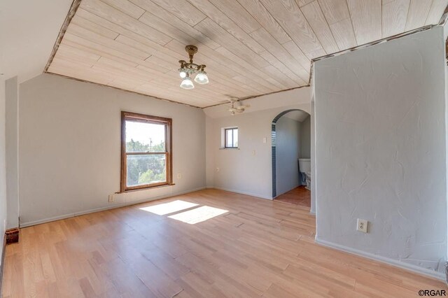 unfurnished room with lofted ceiling, wooden ceiling, and light wood-type flooring