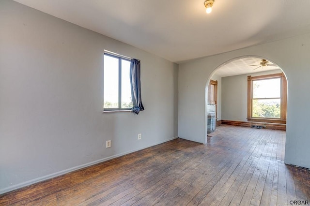 spare room with dark hardwood / wood-style flooring