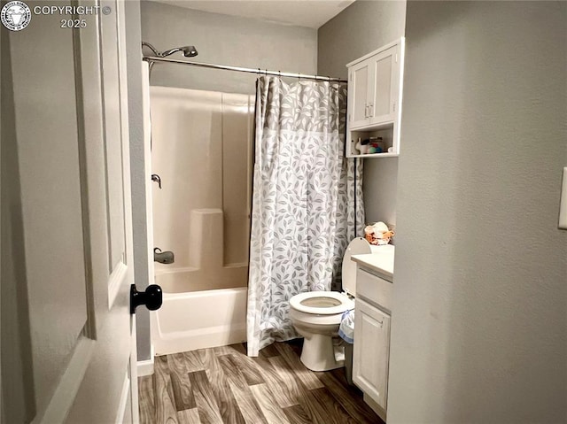204 Indian Hills Rd, Florence, CO 81226 - bathroom featuring wood finished floors, shower / bath combo with shower curtain, and vanity