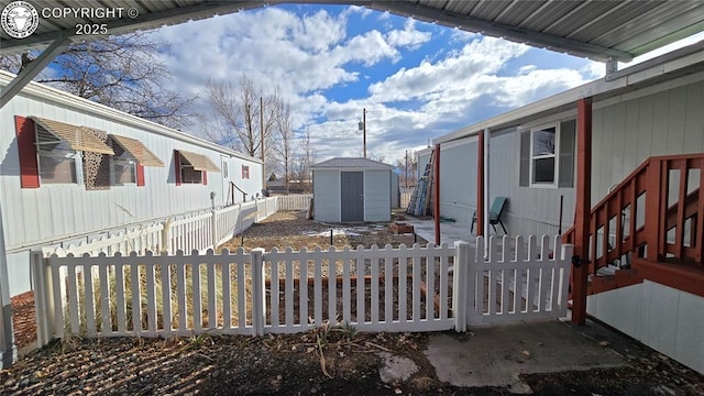 view of side of property with a storage unit