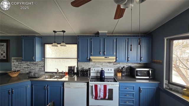 kitchen featuring blue cabinetry, white appliances, decorative light fixtures, and sink