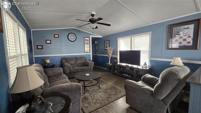 living room featuring dark wood-type flooring, vaulted ceiling, and ceiling fan