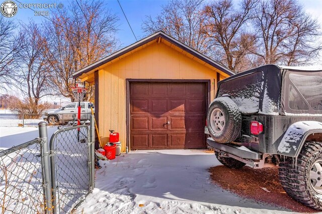 view of snow covered garage