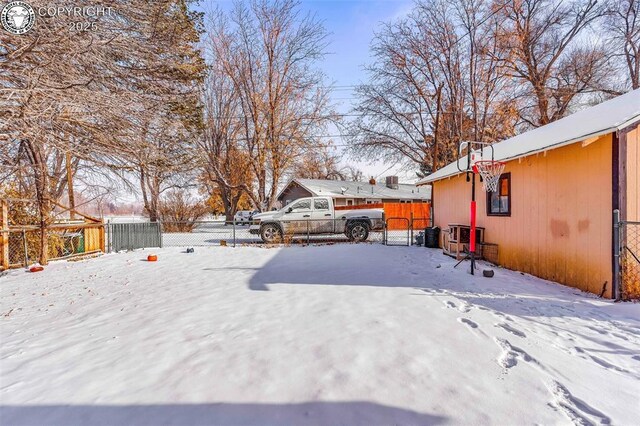 view of yard covered in snow