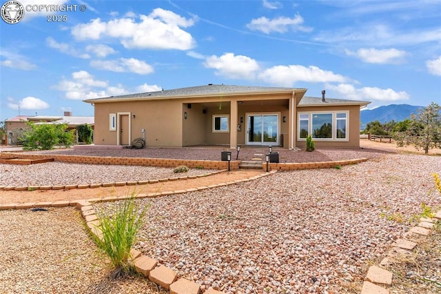 rear view of property with a mountain view