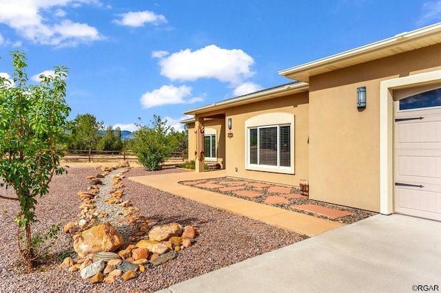 doorway to property with a patio area