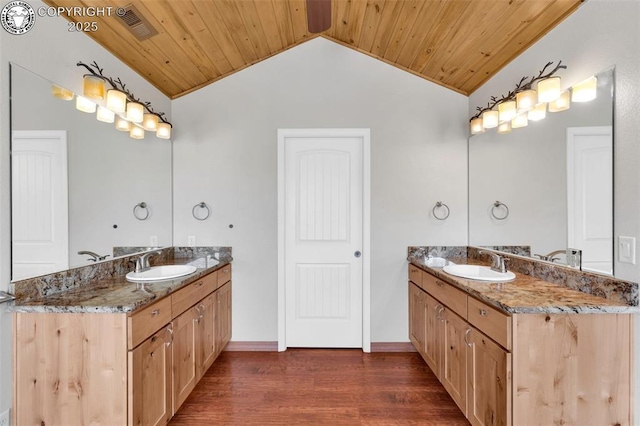 bathroom featuring hardwood / wood-style flooring, vanity, lofted ceiling, and wood ceiling