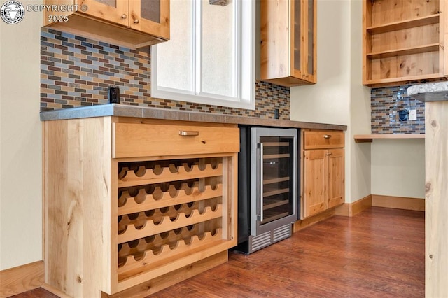 bar with wine cooler, dark hardwood / wood-style flooring, and tasteful backsplash