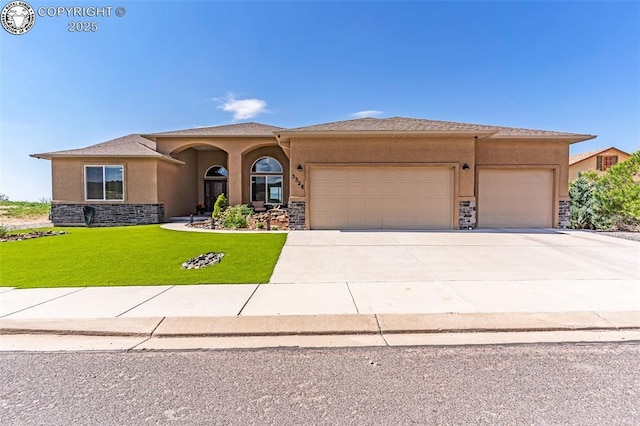 3528 Telegraph Trl, Canon City, CO 81212 - view of front of home featuring stucco siding, an attached garage, stone siding, and a front lawn